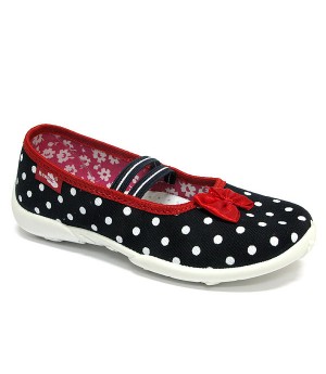 Supportive shoes for a preschool girl with white polka dots